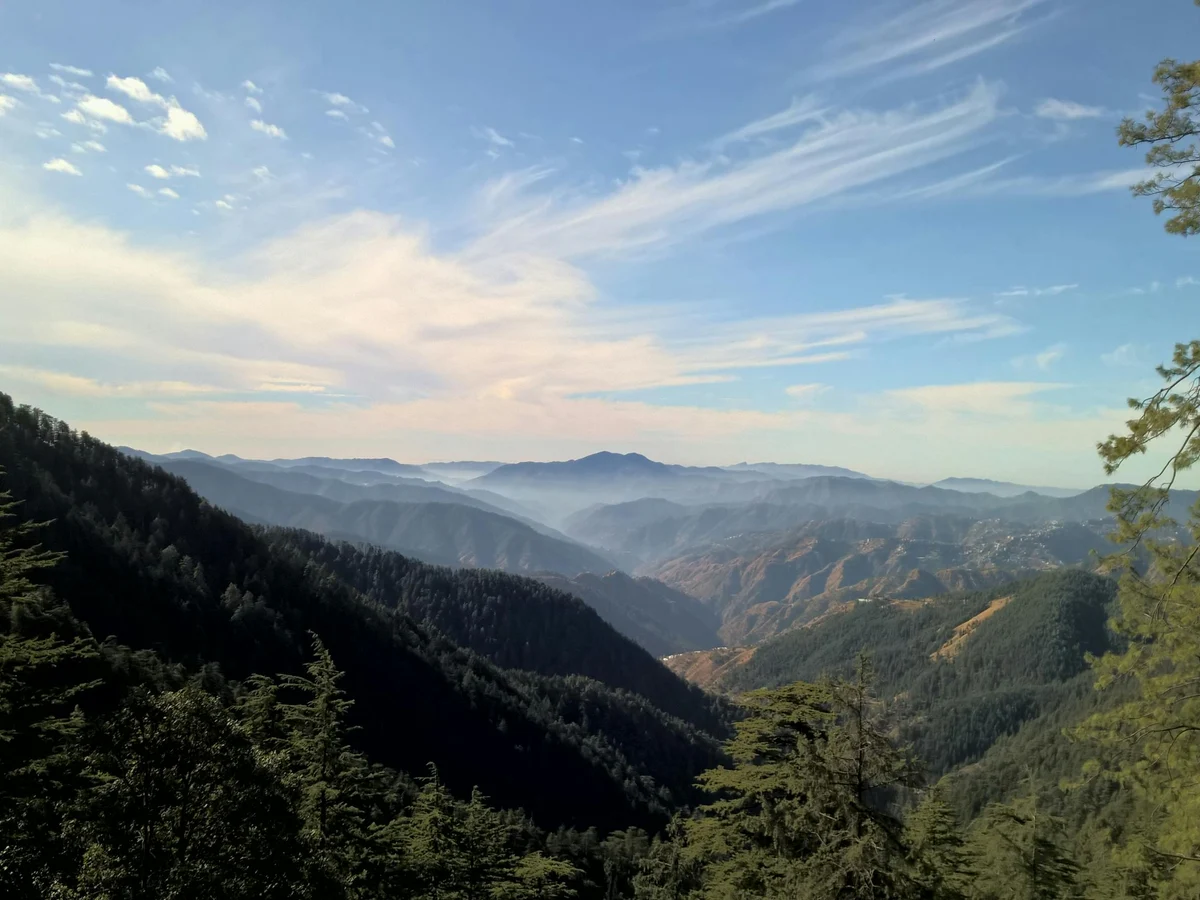 Bird's eye View of Mountain Under Cloudy Sky