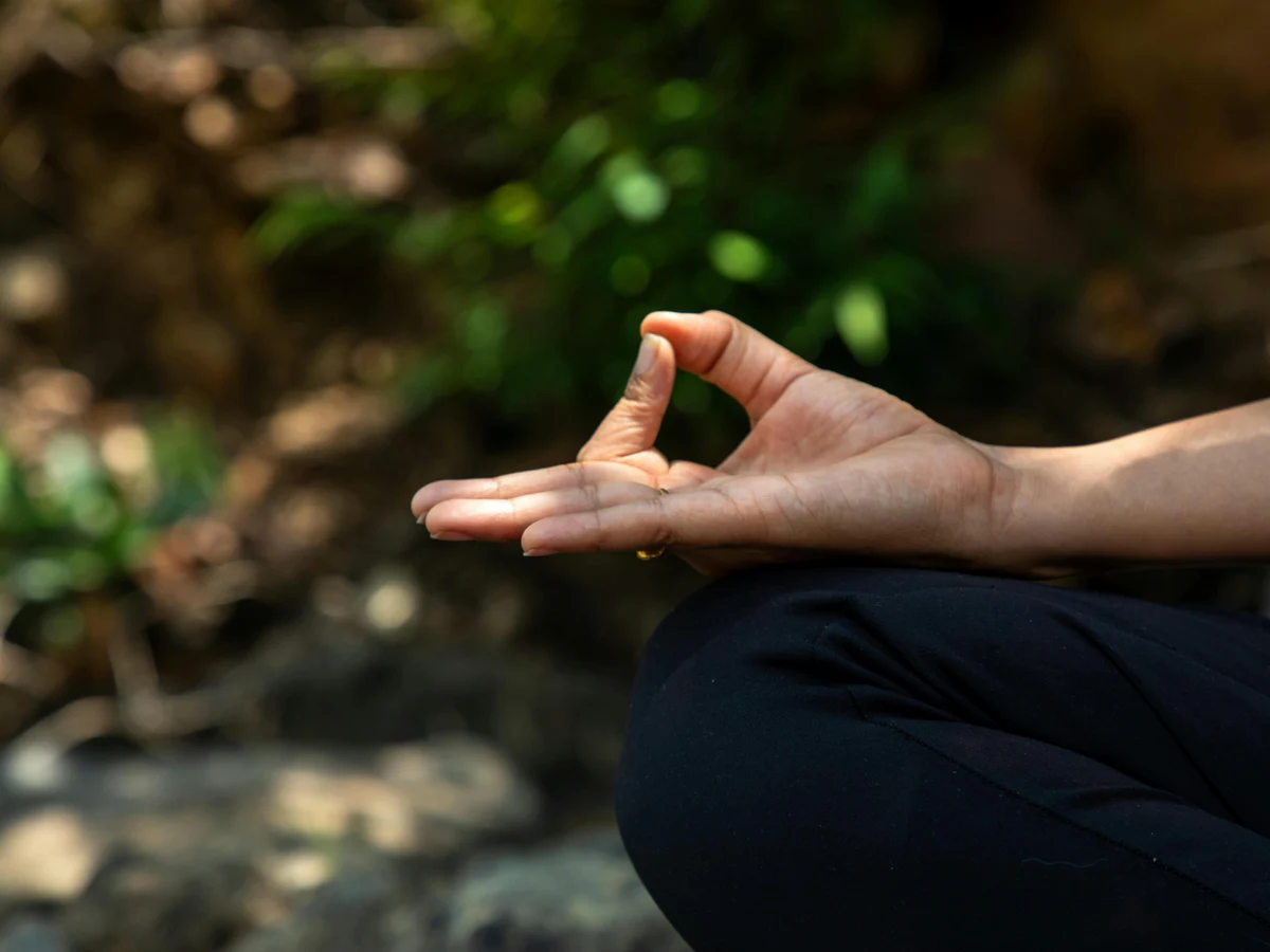 Close up of a Hand in Meditation Pose Outdoors