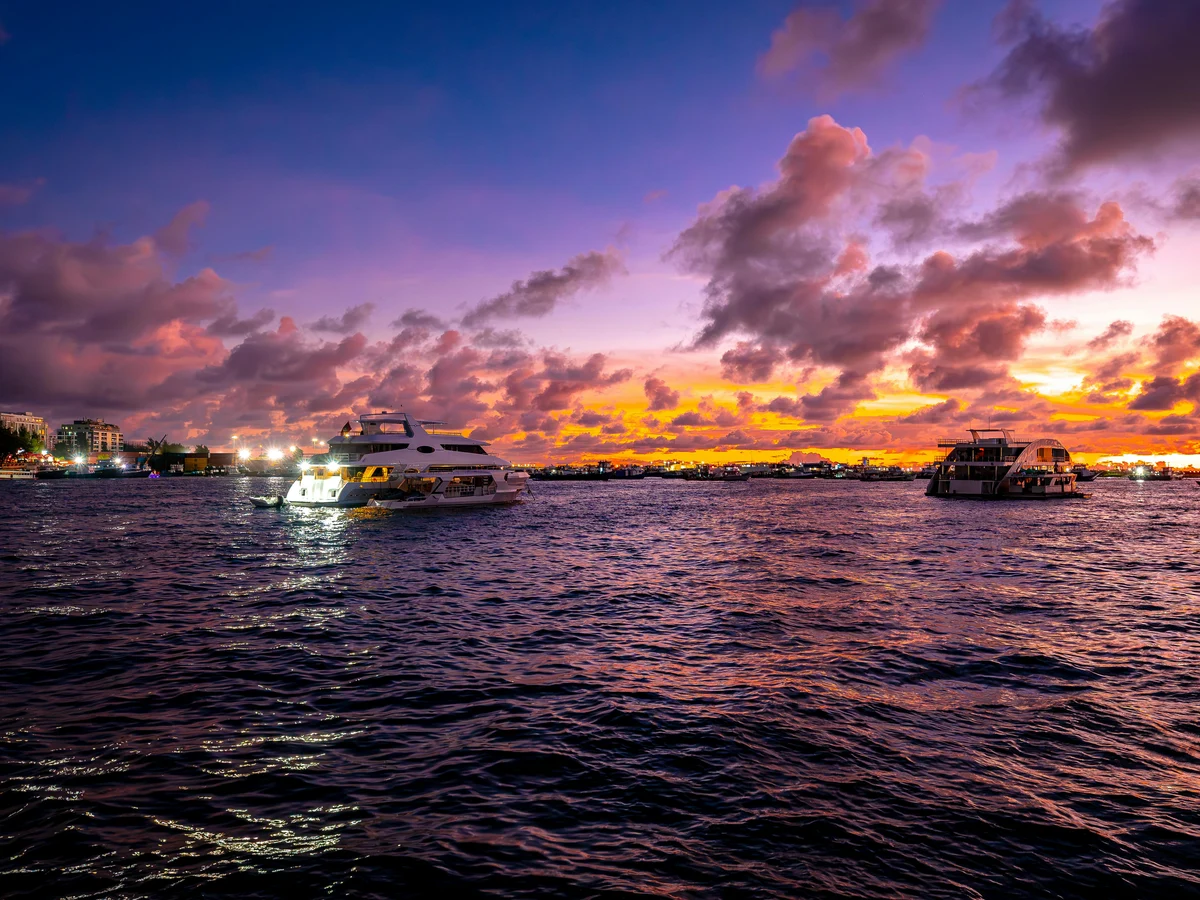 Luxury Yachts at Sunset in the Maldives