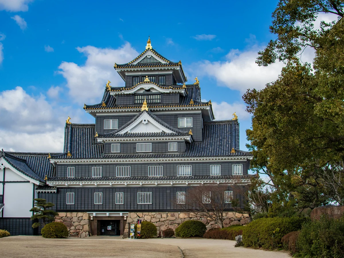 Okayama Castle under a vibrant blue sky, Japan