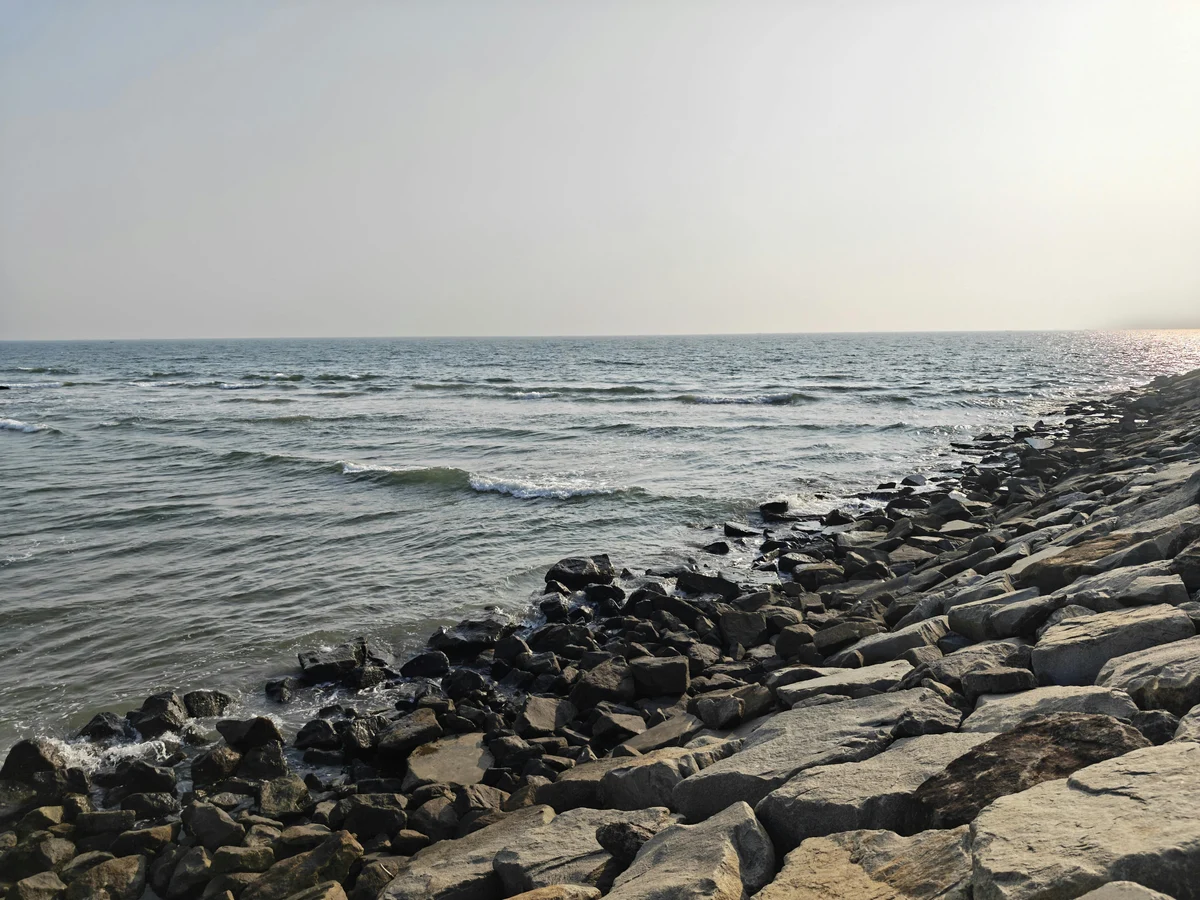 Serene Rocky Coastline at Kannur Beach, Kerala