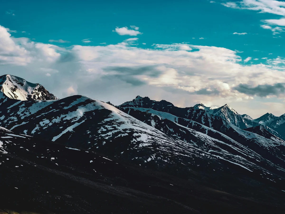 Snow Covered Mountain Under Blue Sky