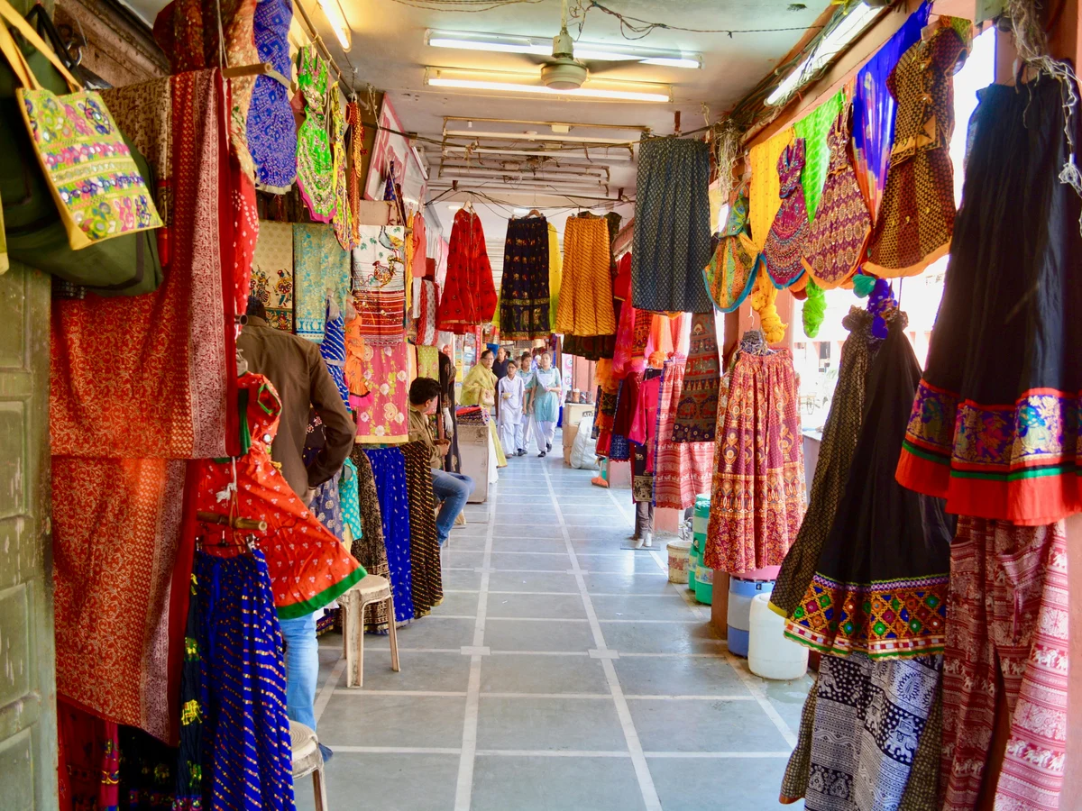 Assorted Clothes Hanged on the Market Place