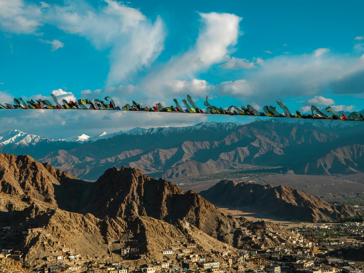 view of building by mountains at daytime