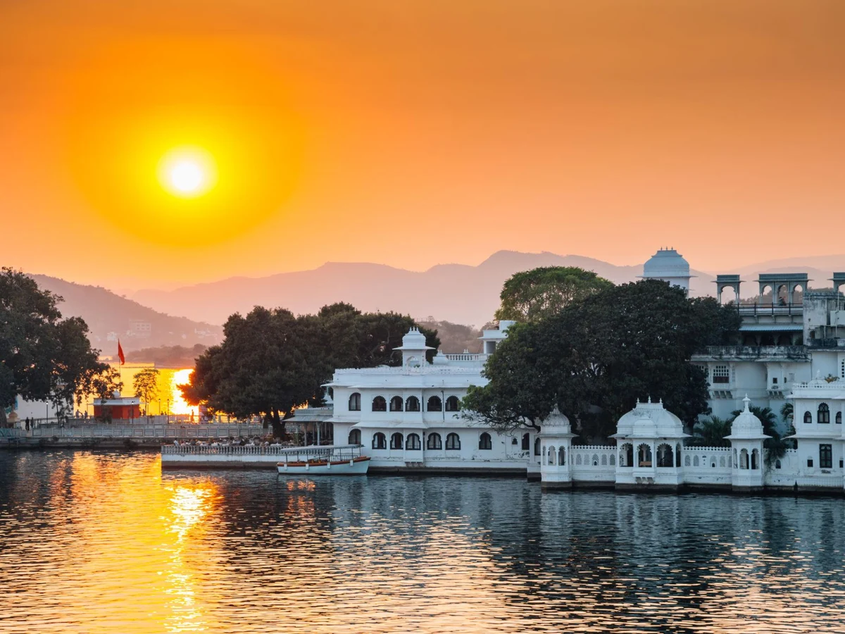 Sunset Pichola lake and Udaipur old town in India