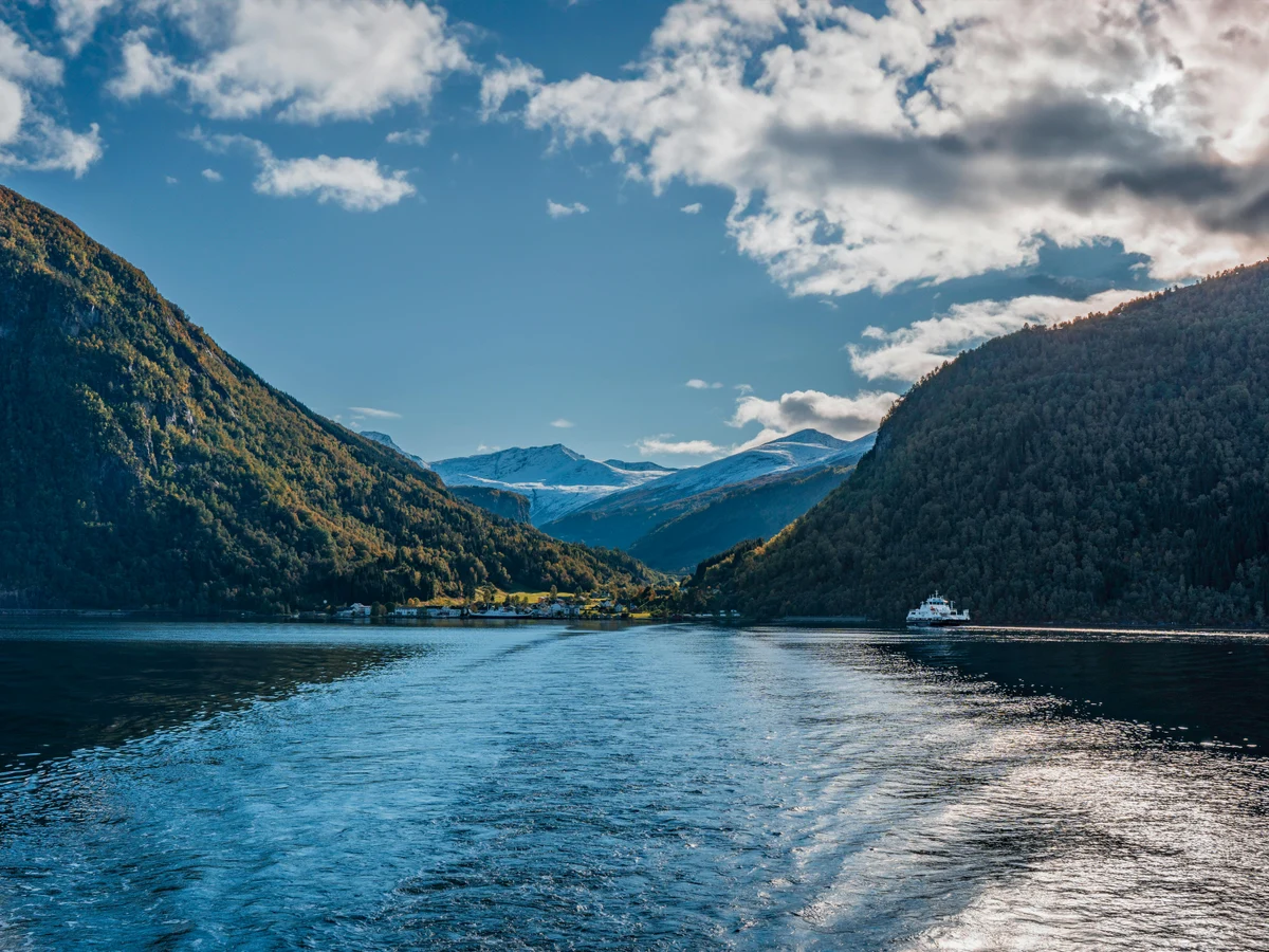 Scenic Norwegian Fjord with Ferry and Mountains