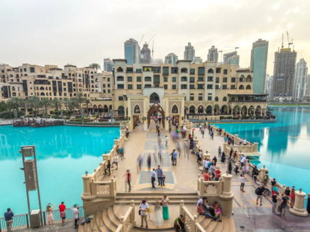 The bridge near the biggest musical fountain in Dubai at sunset