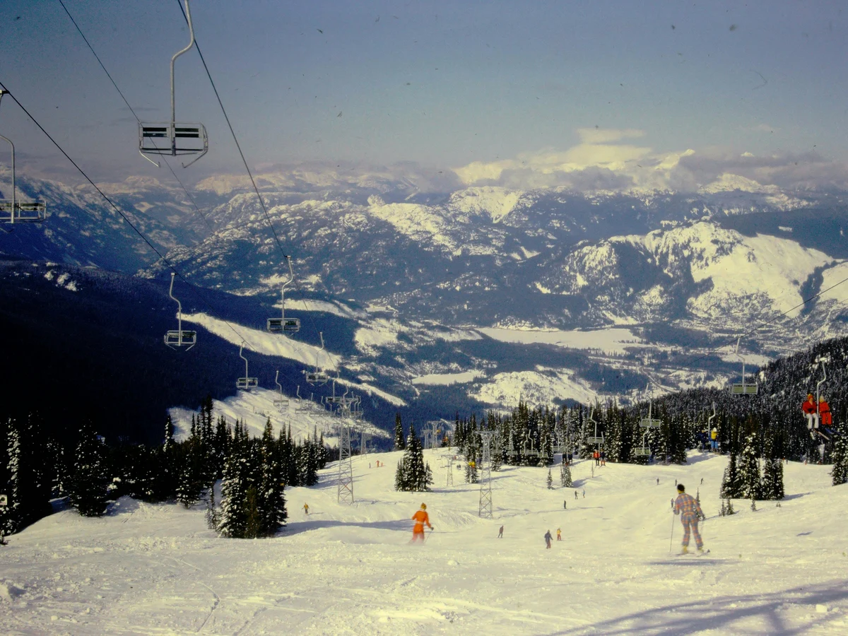Experience the thrill of skiing on snowy mountains with stunning views and ski lifts, Whistler, Canada