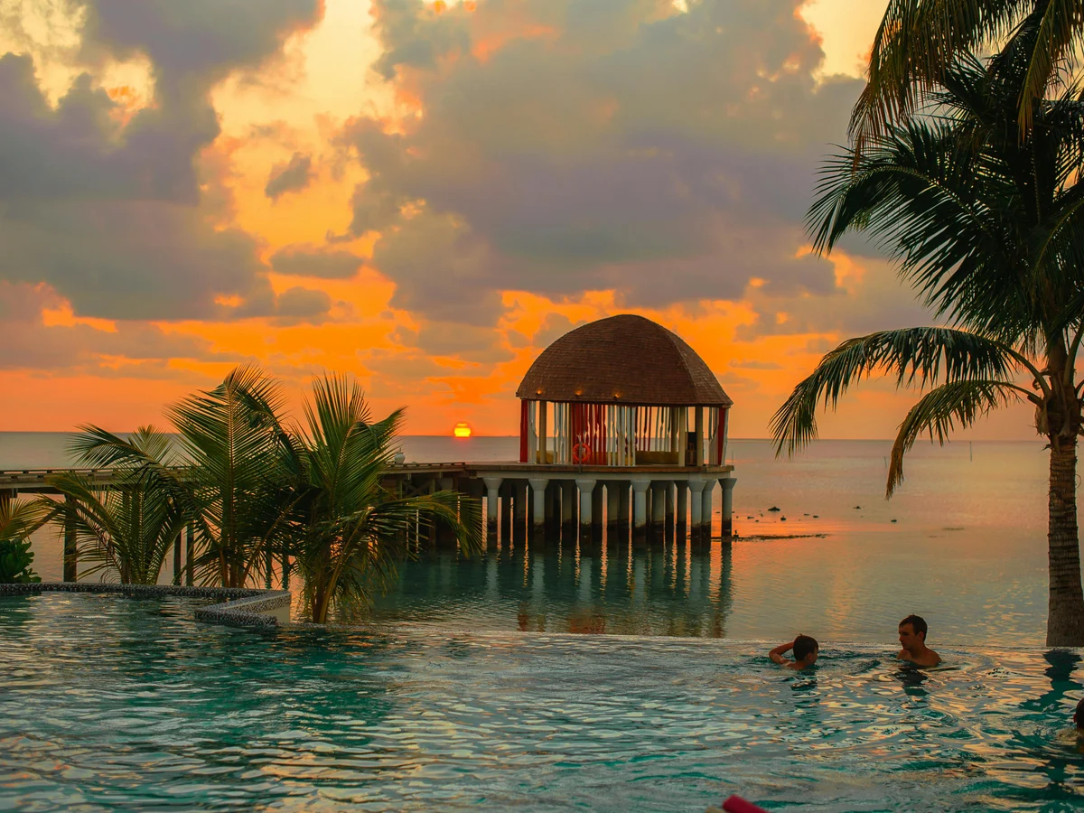 People Swimming on Infinity Pool in Kudafushi Resort, Villingili, Maldives