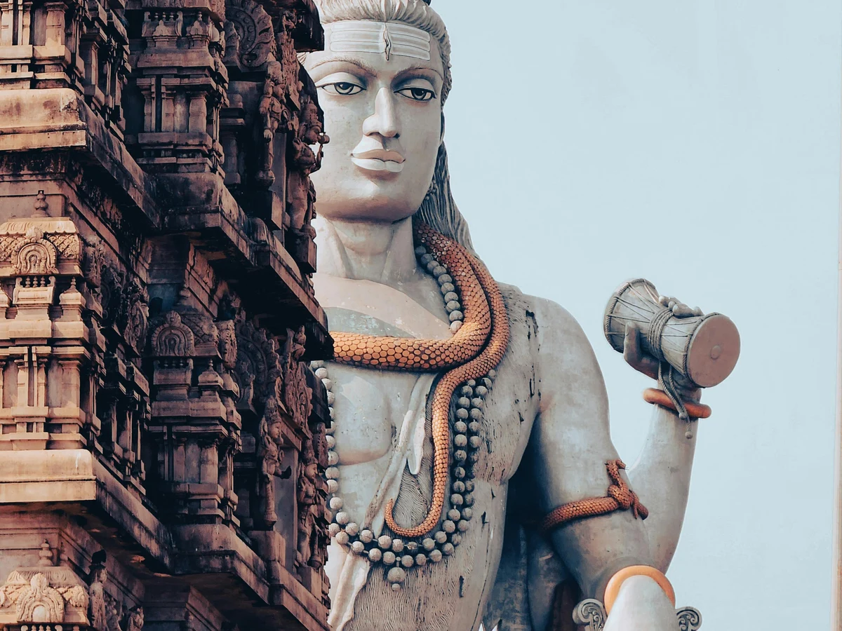 Monumental God Statue behind Temple Wall