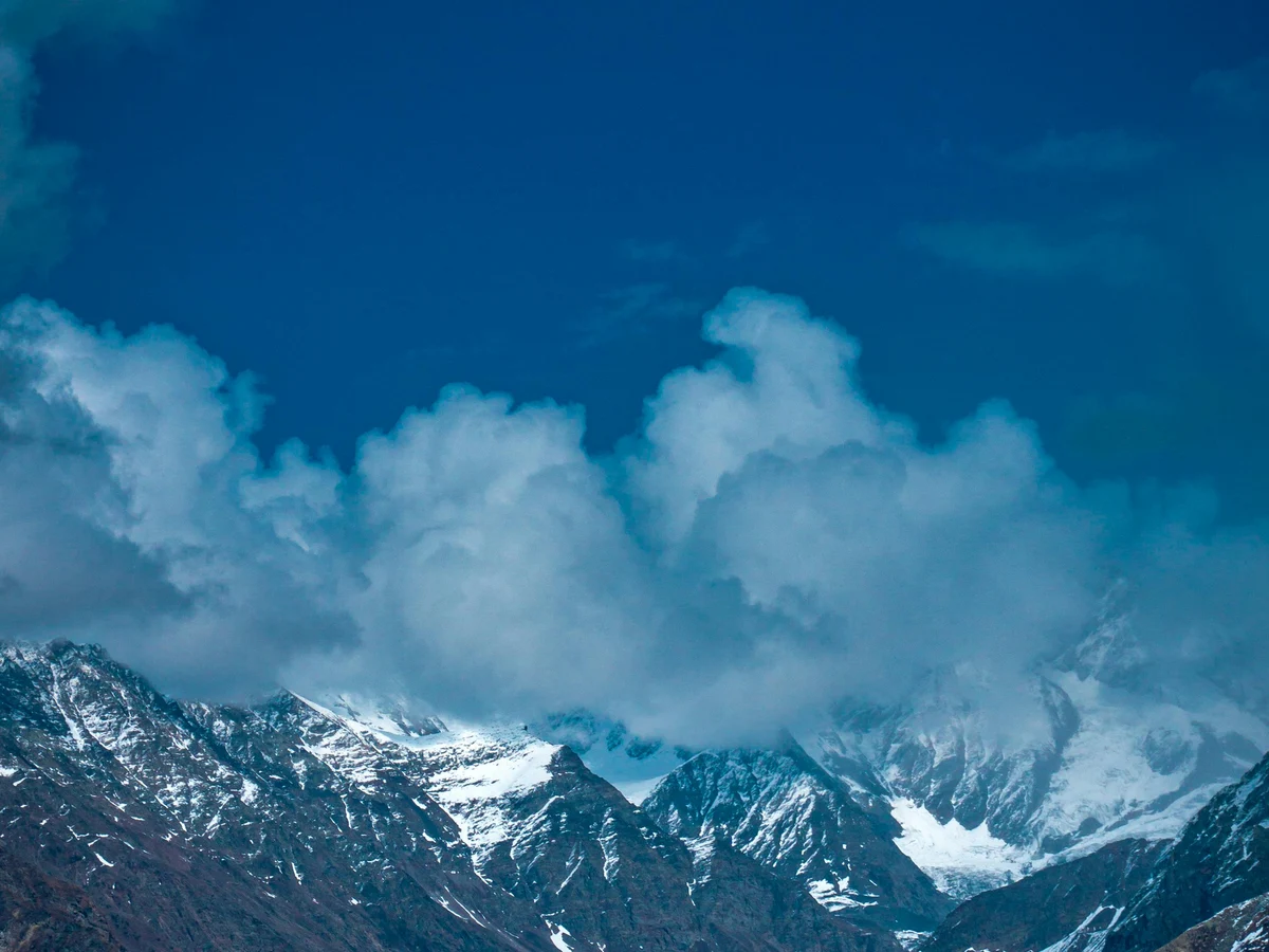 Majestic Snowy Peaks under a Vibrant Blue Sky
